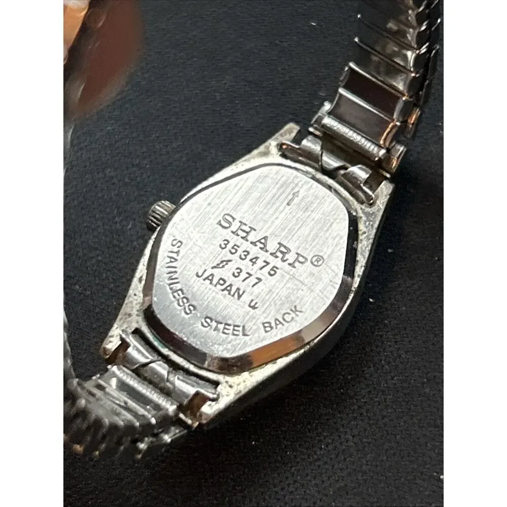 Sharp Silver Tone White Dial Stretch Band Women’s Quartz Watch